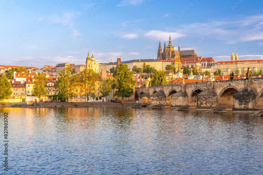 Fototapeta premium Charles bridge (Karlův most) and Hradcany castle hill over Vltava in golden hour,, Prague, Czech Republic