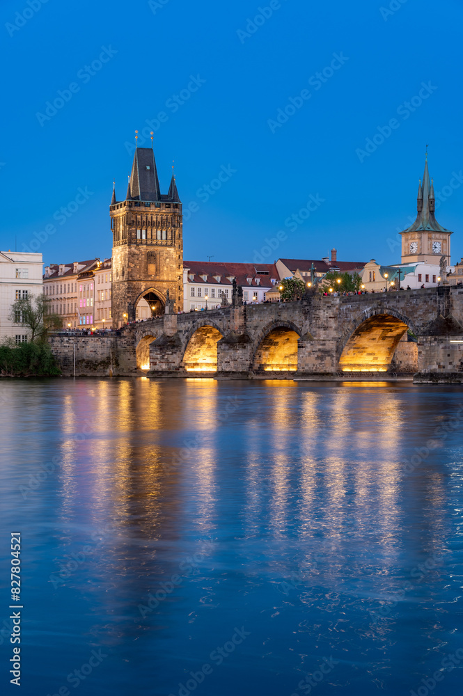 Charles Bridge (Karlův most) over Vltava river, illuminated in the evening, Prague, Czech Republic