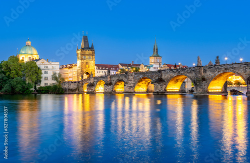 Charles Bridge (Karlův most) over Vltava river, illuminated in the evening, Prague, Czech Republic