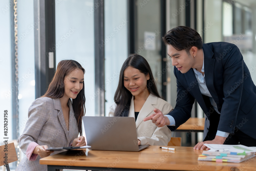 Business professionals are collaborating in an office session. They are discussing and working on a laptop. Business professionals are collaborating in an office session. They are discussing and working on a laptop.