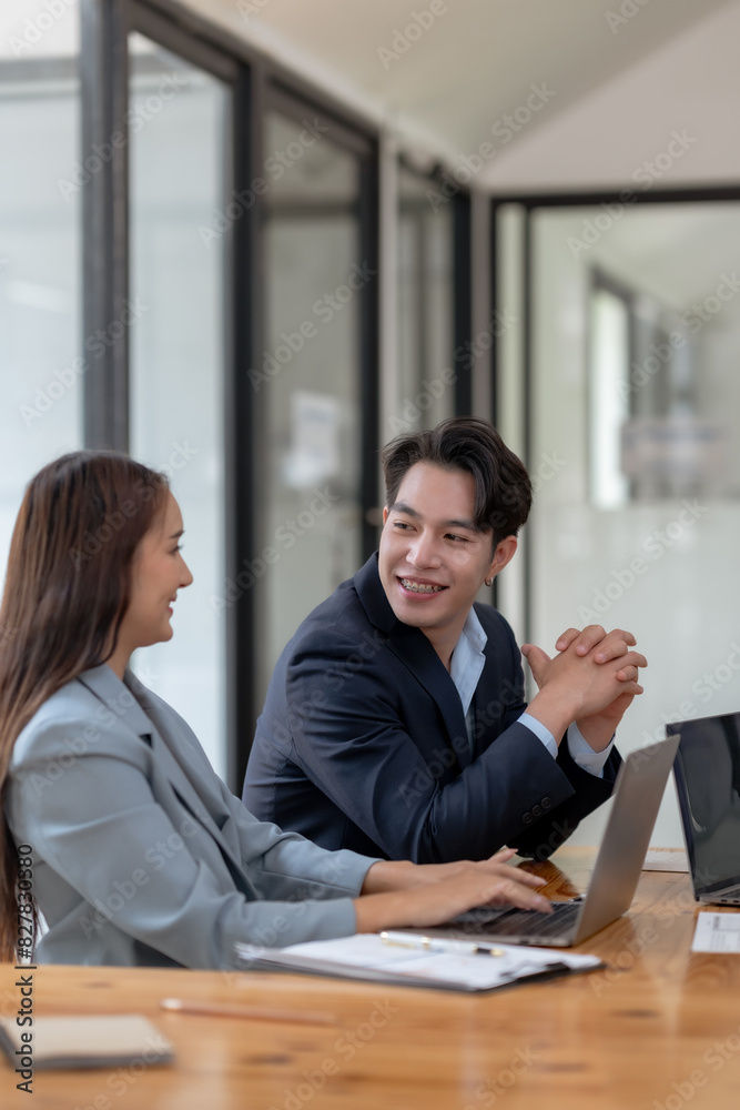 Professional colleagues engaging in a lively conversation at a modern office workspace, collaborating with enthusiasm and positivity. Professional colleagues engaging in a lively conversation at a modern office workspace, collaborating with enthusiasm and positivity.