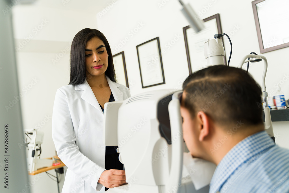 Optometrist conducts a thorough eye examination on a patient using advanced equipment in a contemporary medical facility Optometrist conducts a thorough eye examination on a patient using advanced equipment in a contemporary medical facility
