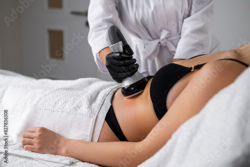 Obraz na plátne Client undergoes vacuum to facilitate removal of liquefied fat cells