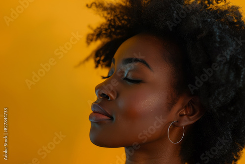 A close up of a black woman's face with her eyes closed looking to a side