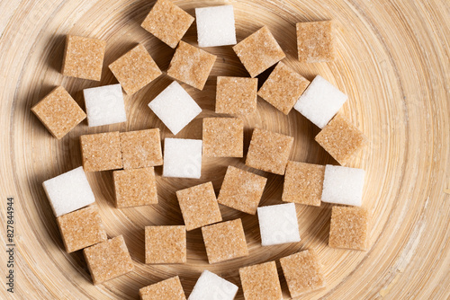 Wallpaper Mural Cubes of cane and white refined sugar on wooden background. Torontodigital.ca