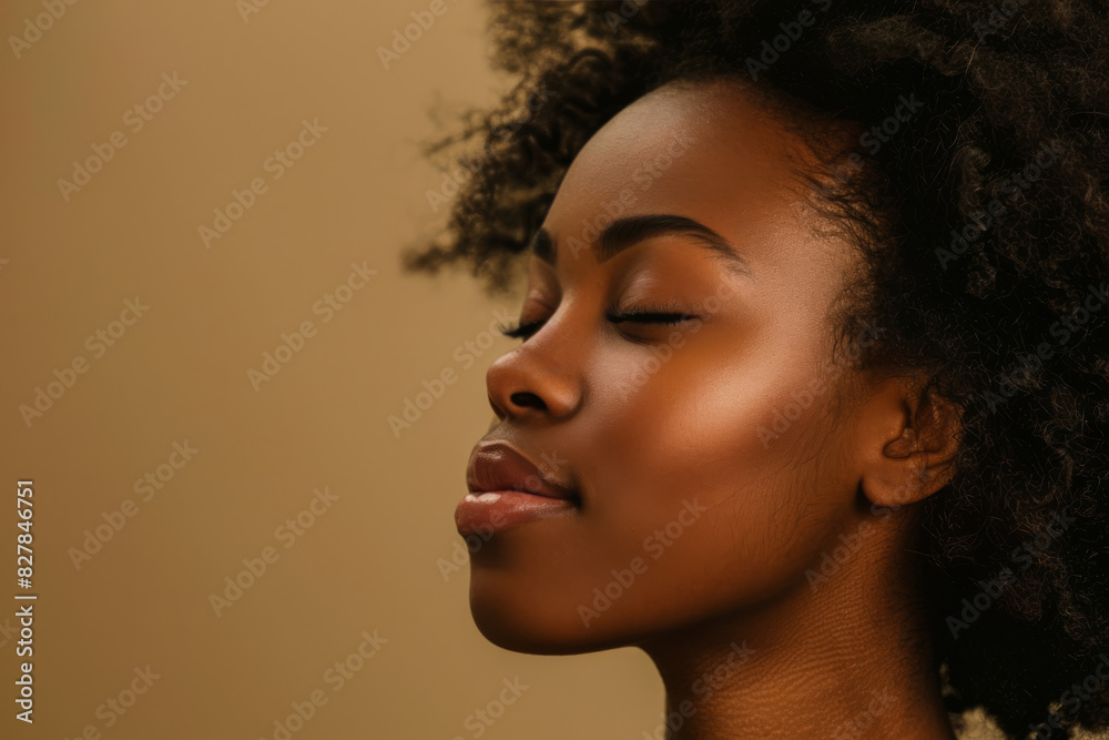A close up of a black woman's face with her eyes closed looking to a side A close up of a black woman's face with her eyes closed looking to a side