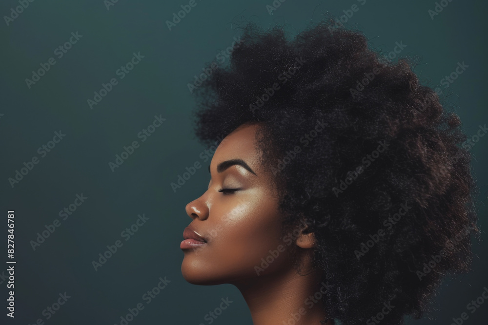 A close up of a black woman's face with her eyes closed looking to a side A close up of a black woman's face with her eyes closed looking to a side