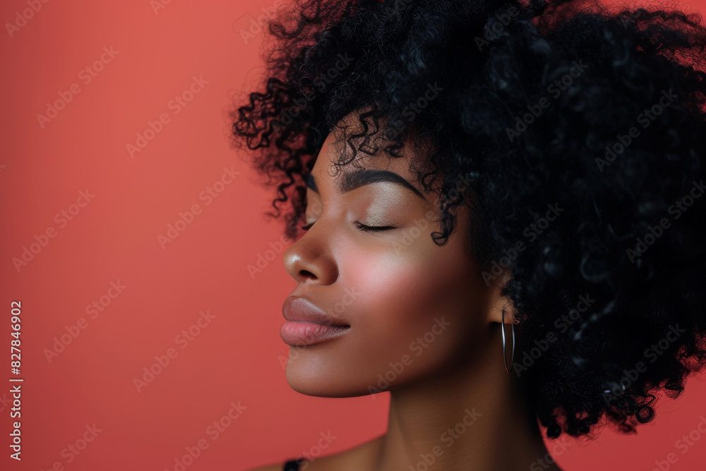 A close up of a black woman's face with her eyes closed looking to a side A close up of a black woman's face with her eyes closed looking to a side