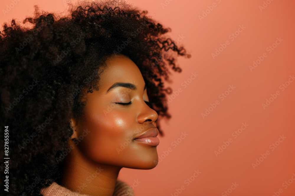 A close up of a black woman's face with her eyes closed looking to a side A close up of a black woman's face with her eyes closed looking to a side