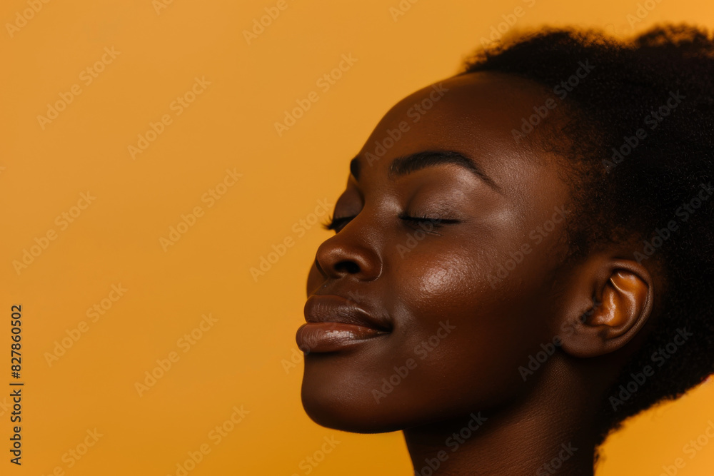 A close up of a black woman's face with her eyes closed looking to a side A close up of a black woman's face with her eyes closed looking to a side