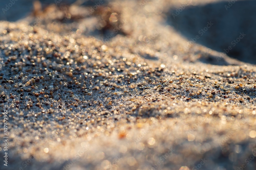 Close-up of natural sand patterns creating soft, wave-like textures on a beach Close-up of natural sand patterns creating soft, wave-like textures on a beach