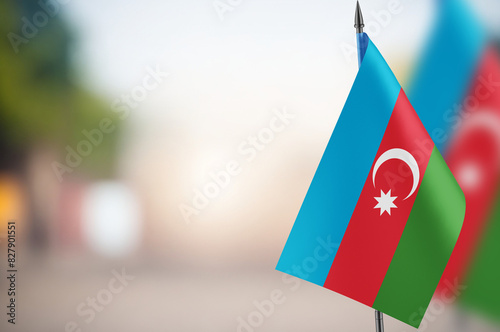 Small flags of Azerbaijan on a blurred background