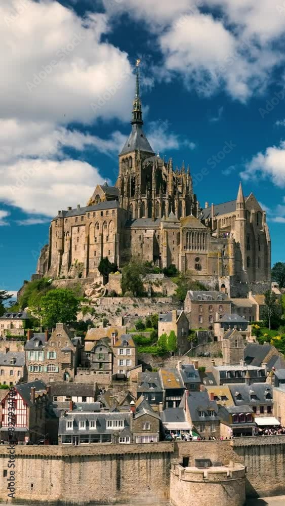 Aerial view of the famous French landmark Abbaye du Mont-Saint-Michel. Normandie. France. Vertical Screen Aerial view of the famous French landmark Abbaye du Mont-Saint-Michel. Normandie. France. Vertical Screen