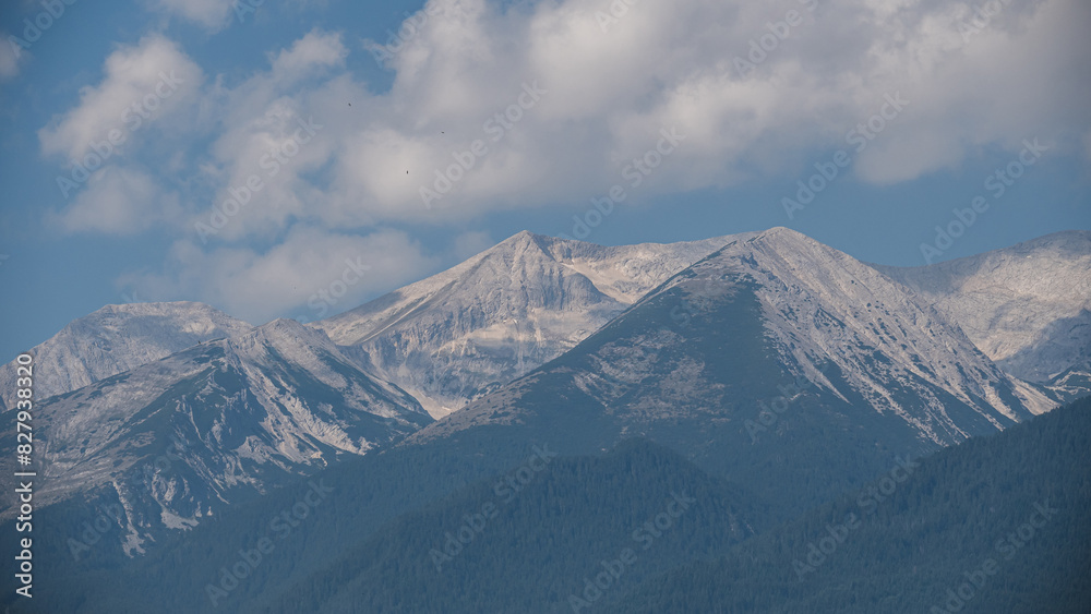 A view of the peaks of the mountains covered with snow
