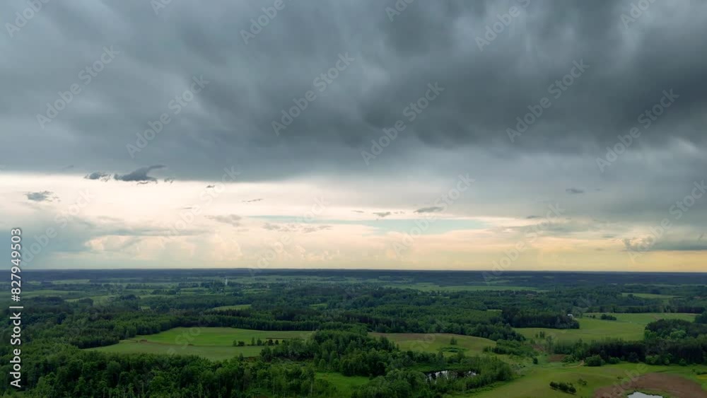 Aerial Time-Lapse of Countryside Landscape with Storm Clouds and Rain Showers Over Green Fields, Lithuania. Aerial Time-Lapse of Countryside Landscape with Storm Clouds and Rain Showers Over Green Fields, Lithuania.
