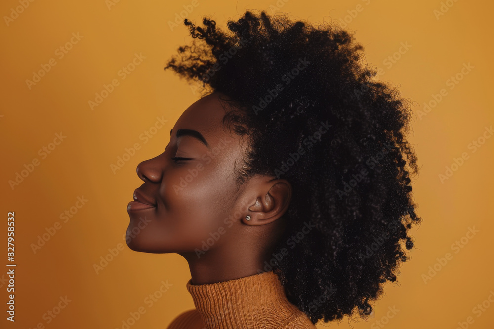 A close up of a black woman's face with her eyes closed looking to a side A close up of a black woman's face with her eyes closed looking to a side