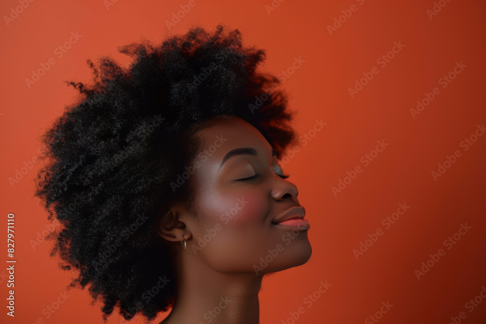 A close up of a black woman's face with her eyes closed looking to a side A close up of a black woman's face with her eyes closed looking to a side