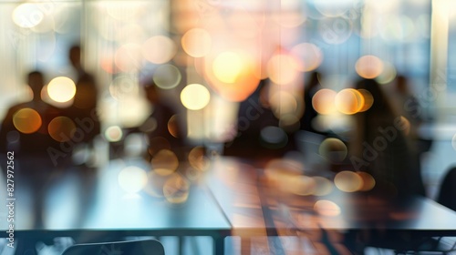 Blurry image of people interacting during a meeting in an office