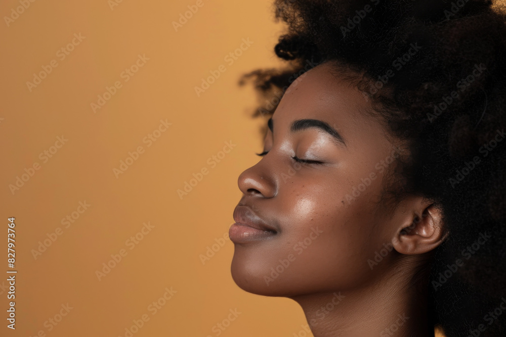 A close up of a black woman's face with her eyes closed looking to a side A close up of a black woman's face with her eyes closed looking to a side