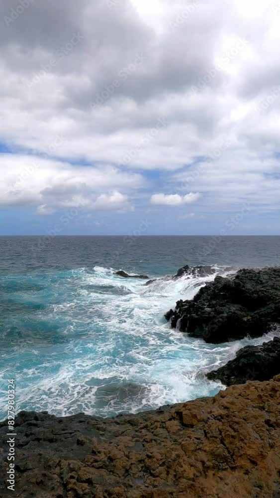 The turquoise color of the ocean contrasts with the lava black of the coast of Lanzarote in the Canary Islands The turquoise color of the ocean contrasts with the lava black of the coast of Lanzarote in the Canary Islands