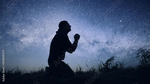Religious Young Man Bowing in Prayer Sylhouette on Starry Night Sky Spirituality God Christ Belief Worship Praise Happiness 8K
