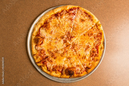 Large plain pizza on a tray