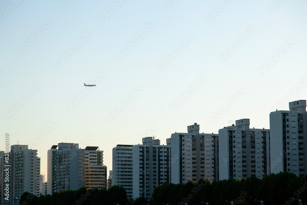 View of the flying airplane over the apartment View of the flying airplane over the apartment