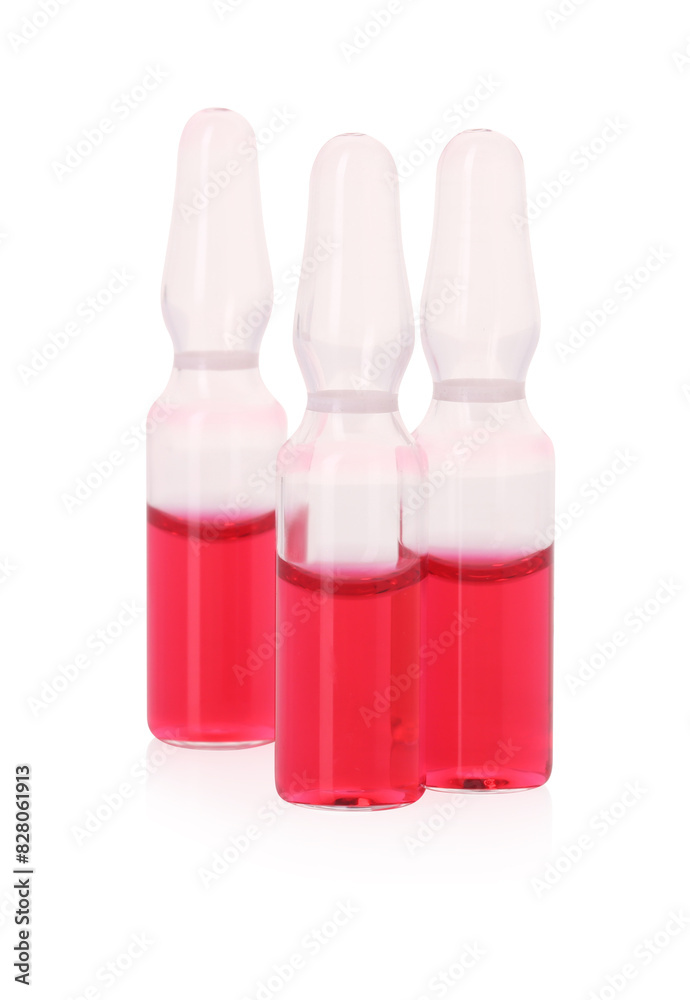 Glass ampoules with liquid isolated on white Glass ampoules with liquid isolated on white