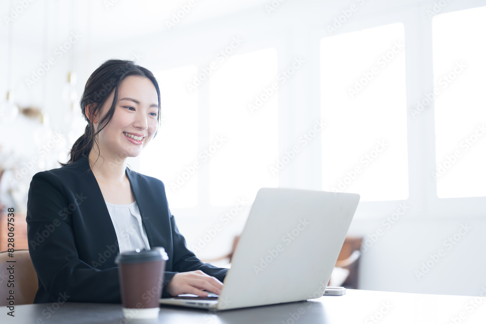 Top close-up of a woman typing on a computer in a beautifully backlit office with space for photocopying Top close-up of a woman typing on a computer in a beautifully backlit office with space for photocopying