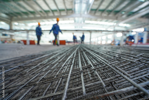 Obraz na płótnie Workers are moving metal mesh in the workshop, North China w salonie