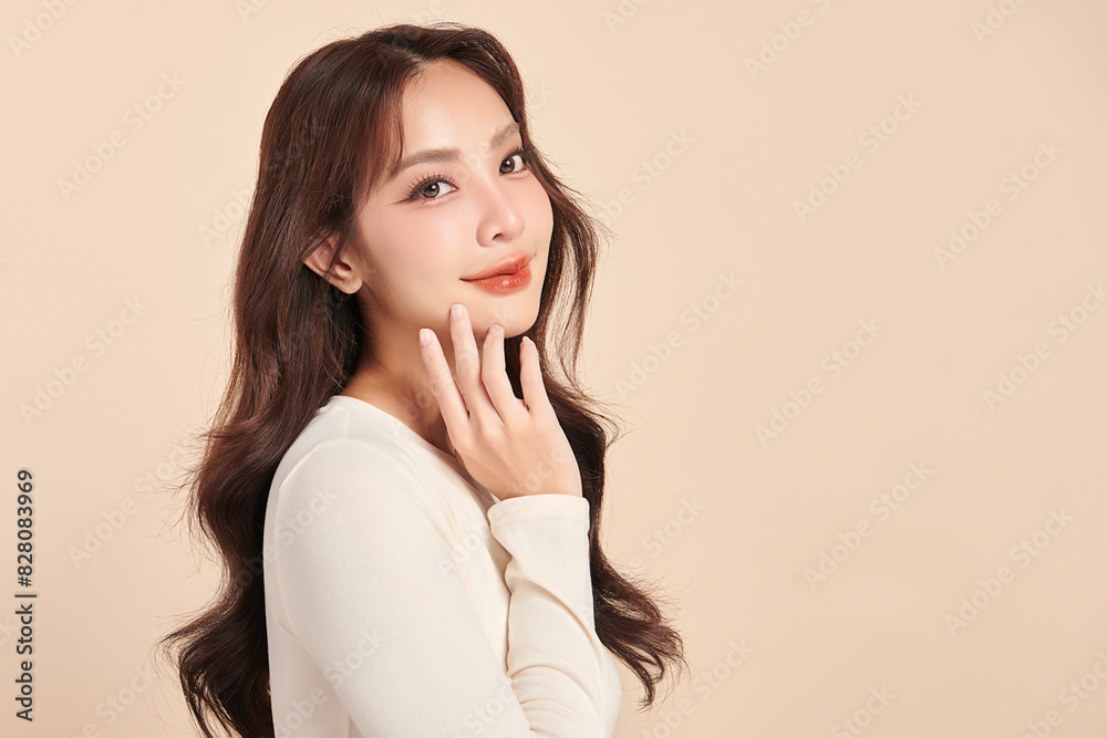 Beautiful young asian woman with clean fresh skin on beige background, Face care, Facial treatment, Cosmetology, beauty and spa, Asian women portrait. Beautiful young asian woman with clean fresh skin on beige background, Face care, Facial treatment, Cosmetology, beauty and spa, Asian women portrait.