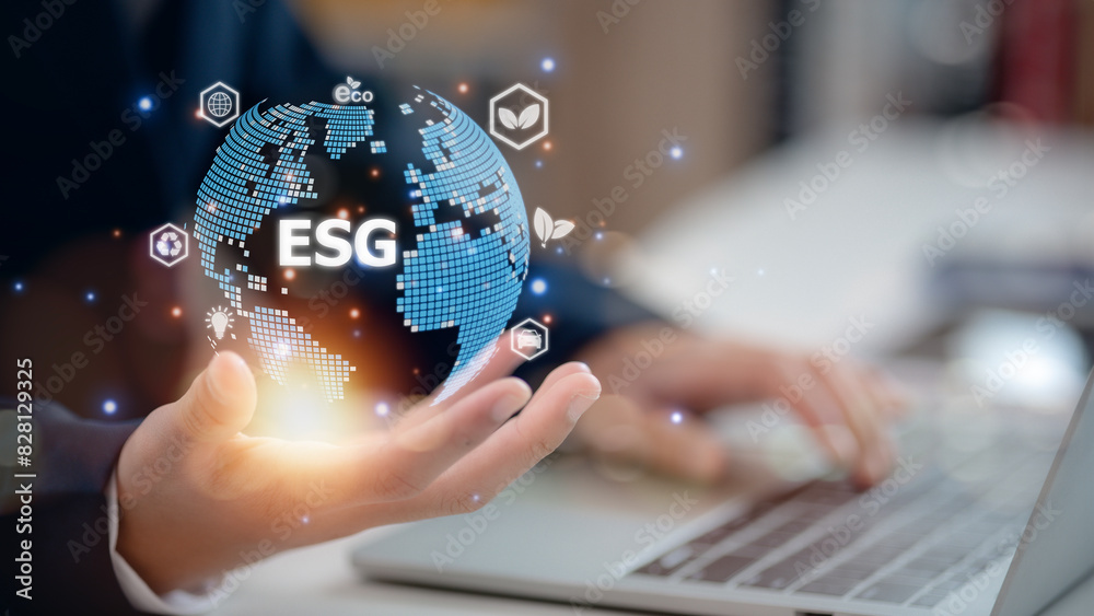 Naklejka premium Analyze investment ESG by ESG icons.ESG environment concept. close to the computer screen in the business investment strategy concept.