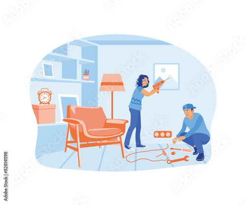 A woman is putting up a painting on the wall while a man repairs an electrical installation. Home repair concept. Flat vector illustration.