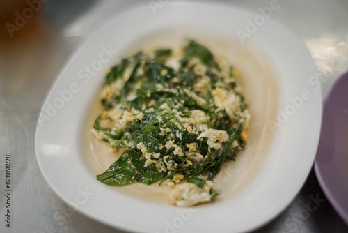 Stir-fried Malindjo Leaves with Egg photo