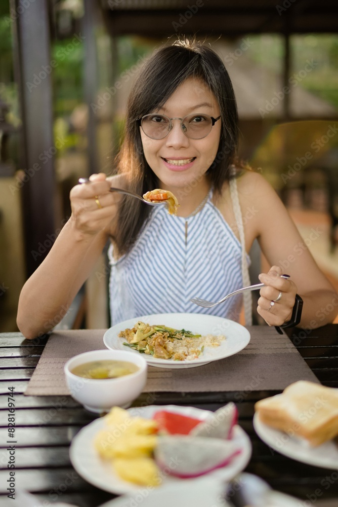 asian women eating breakfast on the table asian women eating breakfast on the table