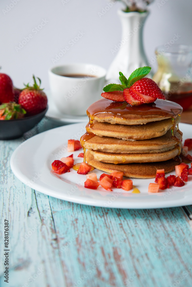 Stack of pancakes hotcakes with honey and strawberries breakfast food american style Stack of pancakes hotcakes with honey and strawberries breakfast food american style