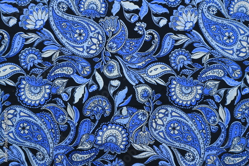 Blue paisley pattern fabric background