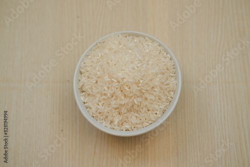 A bowl of rice on a wooden table