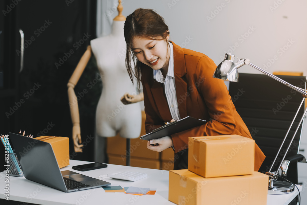 Φωτογραφία Portrait of Starting small businesses owners female entrepreneurs working on receipt box and check online orders to prepare to pack the boxes, sell to customers, sme business ideas online