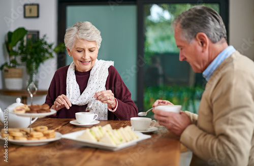 Senior couple  tea and lunch in home for relax  food and drink for married man and woman. Living room  dinning room and table for retirement with romance  snacks and beverages for happy people