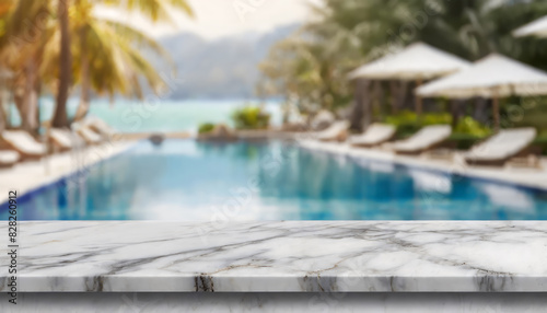 Empty white marble stone table top and blurred swimming pool in tropical resort in summer banner background
