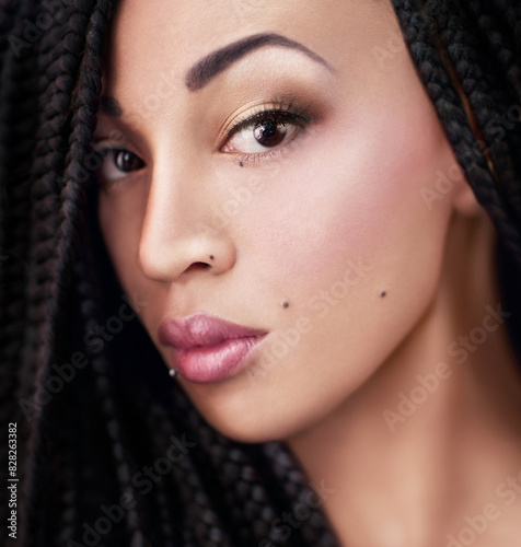African woman, makeup and beauty in portrait for confidence, glow or foundation for cosmetics. Girl, model and person with lipstick, braids and shine with piercing, aesthetic or facial transformation