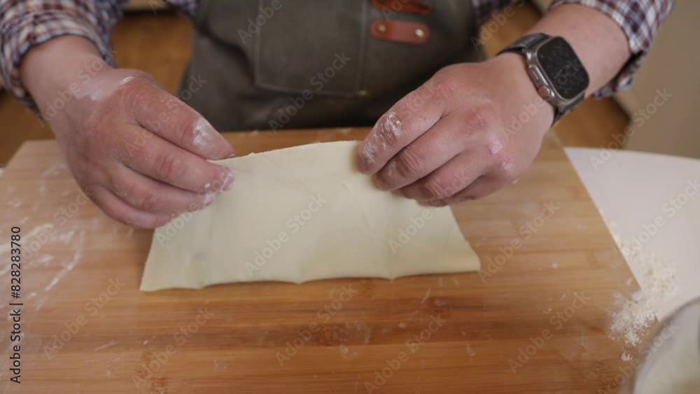 a male chef makes kutab dough in a home kitchen a male chef makes kutab dough in a home kitchen