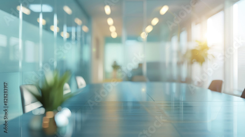 A large conference room with a glass wall and a potted plant on the table