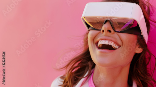 A woman wearing a pair of virtual reality goggles is smiling
