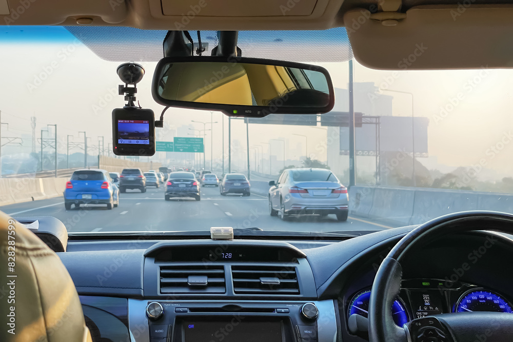 Φωτογραφία Bright and clear image interior of the car show steering wheel, dashboard,car stereo, car camera and air conditioning ventilation with traffic outside on summer morning background