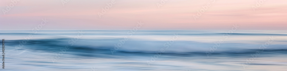 Tranquil Seashore with Gentle Waves Under Soft Sunset