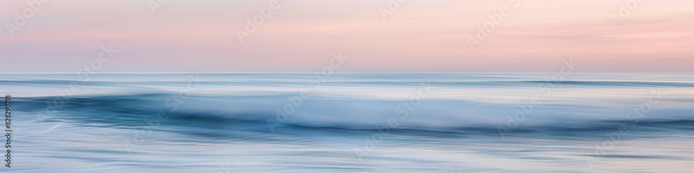 Fototapeta premium Tranquil Seashore with Gentle Waves Under Soft Sunset