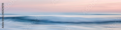 Tranquil Seashore with Gentle Waves Under Soft Sunset