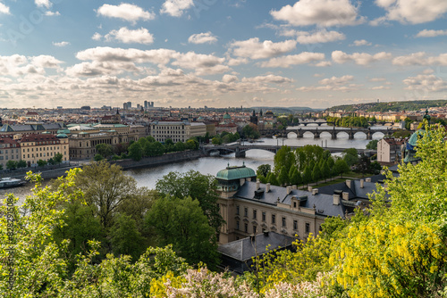 Old town of Prague. Czech Republic over river Vltava with Charles Bridge on skyline. Prague panorama landscape view with red roofs. Prague view from Letna Park, Prague, Czechia.